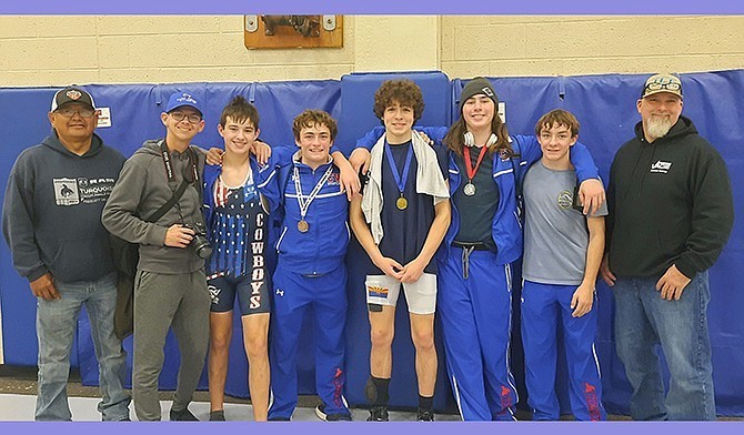 From left, coach Calvin Bahe, manager Austin Dexter, sophomore Ari Hammond 144 pounds., junior Joey Dickey 157 pounds, senior Jeremy Jones 150 pounds, senior Tristan Black 215 pounds, sophomore Jake Dickey 132 pounds, and head coach Travis Black. Not pictured: sophomore Jacob Jones 138 pounds, and junior Austin Pomeroy 165 pounds. (Photo courtesy of Peggy Kellogg)